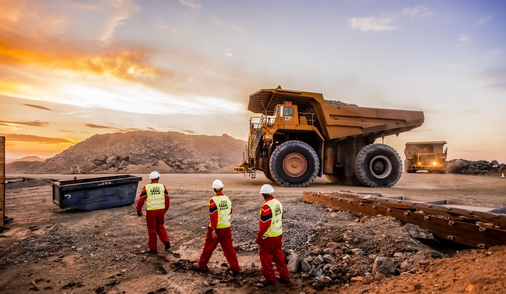 Miners in front of truck light